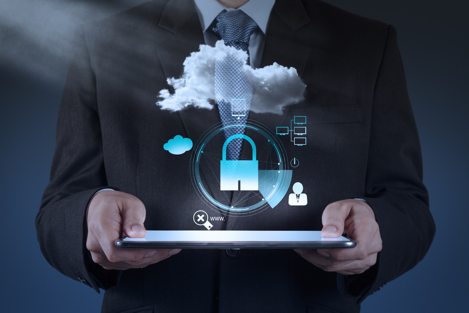  A businessman in a suit is holding a tablet with a cloud data privacy best practices concept.